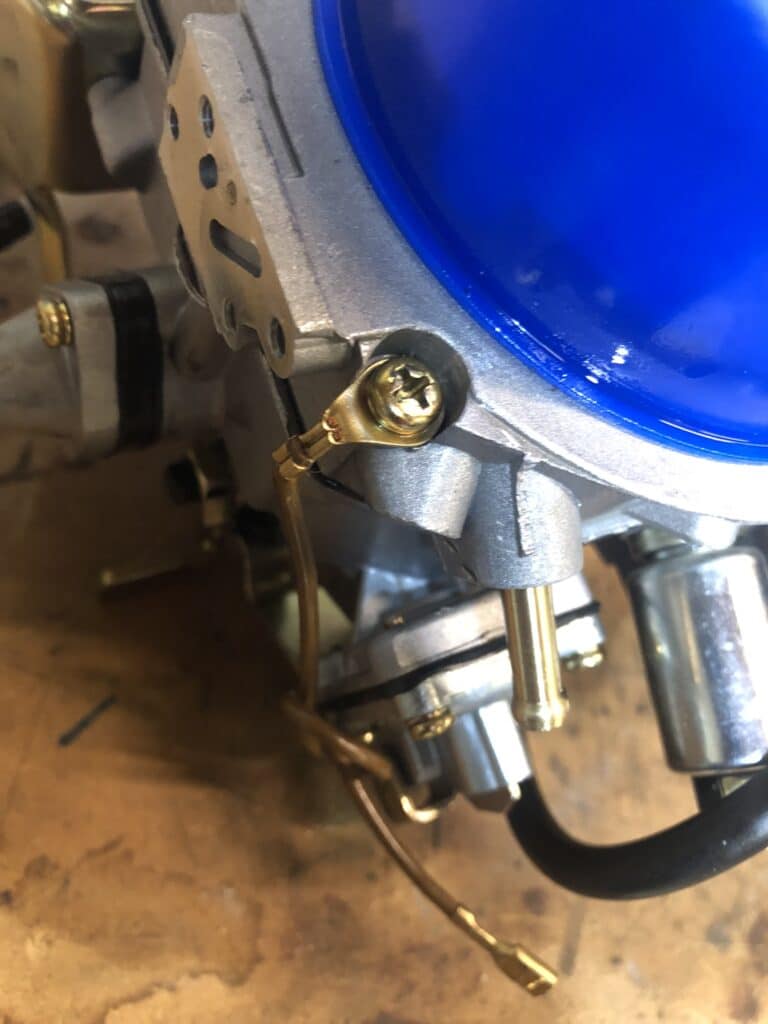 Paruzzi 2E3 carburettor showing fuel inlet pipe and earth wire (not needed)