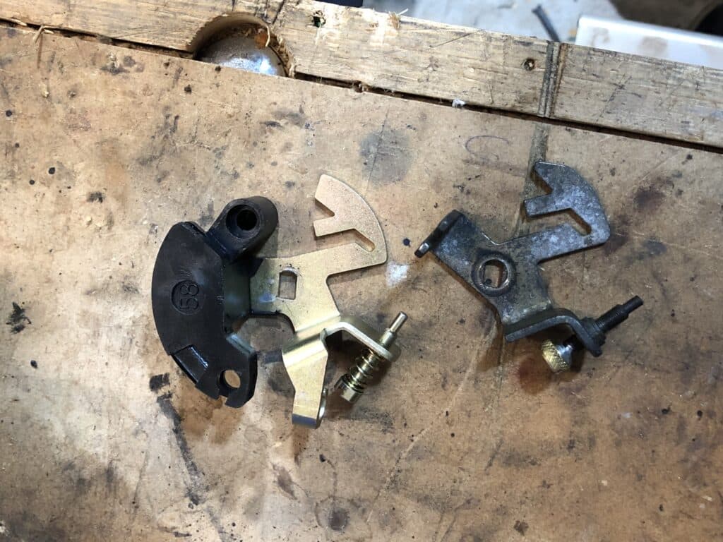 Showing the difference between two parts removed from the Paruzzi 2E3 carburettor (left) and the Pierburg 2E3 carburettor (right).